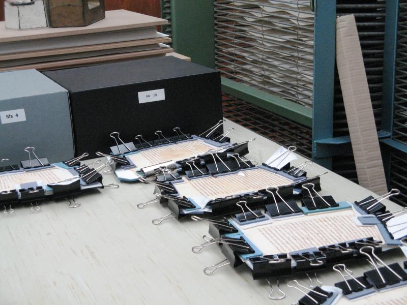 17. Stretched folios waiting to be placed in the press.